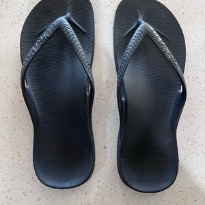 Archie’s Black Flip Flops